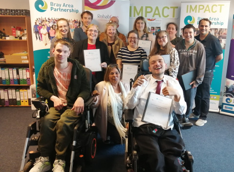Group of people with their certificates at IMPACT Initiative
