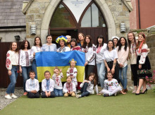 Ukrainian adults and children posing in national costume outside our Ukrainian Community Centre in Bray.